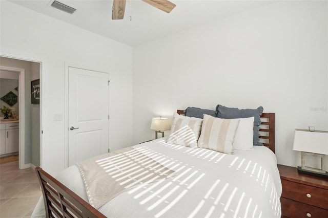 tiled bedroom with ceiling fan