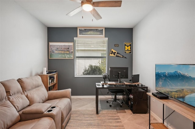 tiled office space featuring ceiling fan