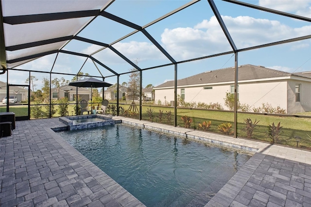 view of swimming pool featuring a patio, a lanai, and an in ground hot tub