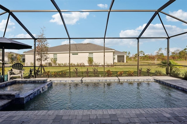 view of swimming pool with a lanai, pool water feature, and a yard