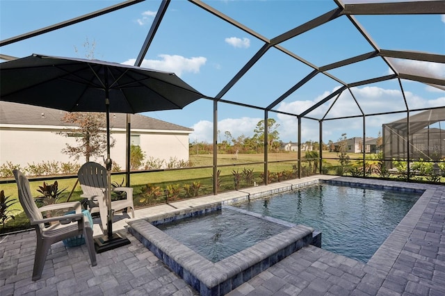 view of pool with a lanai and a patio