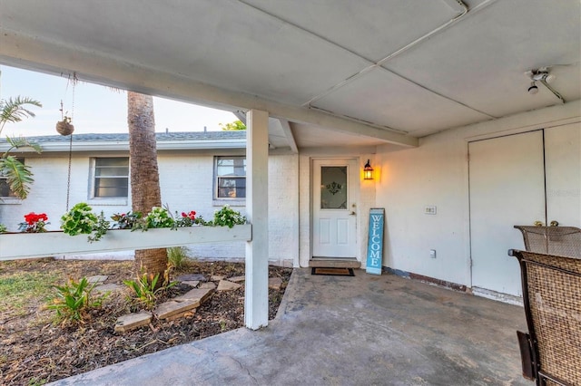 doorway to property featuring a patio