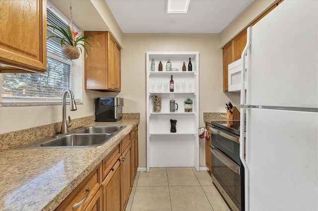 kitchen with light tile patterned flooring, white appliances, and sink