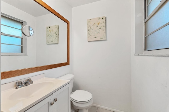 bathroom with tile patterned floors, vanity, and toilet