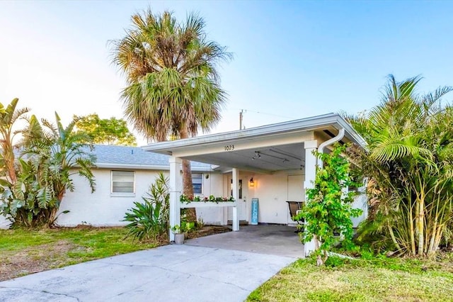 view of front of home featuring a carport