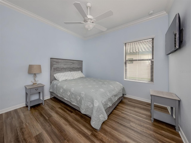 bedroom with dark hardwood / wood-style floors, ceiling fan, and ornamental molding