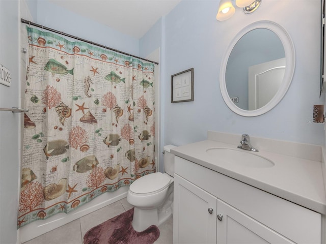 full bathroom with tile patterned floors, shower / bath combo with shower curtain, vanity, and toilet