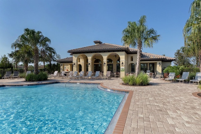 view of swimming pool featuring a patio area