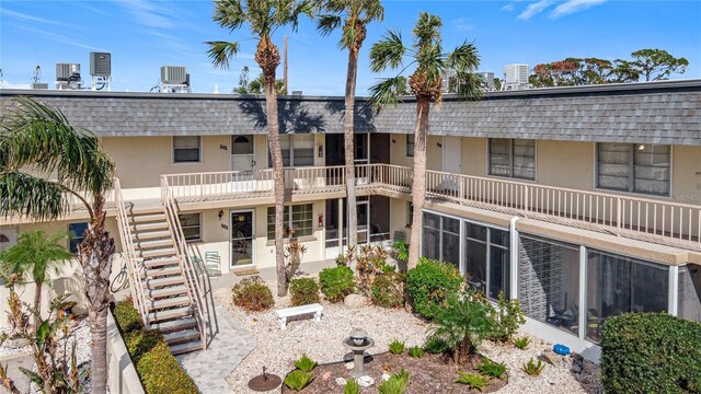200 Park Blvd N Unit 103, Venice, FL 34285 - view of property with stairway and central air condition unit