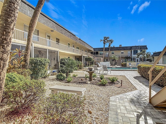 exterior space featuring a balcony and a patio area