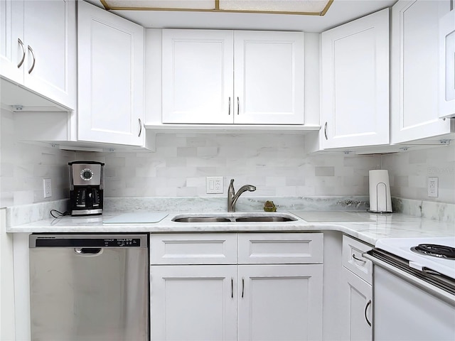 kitchen with dishwasher, white cabinetry, and sink