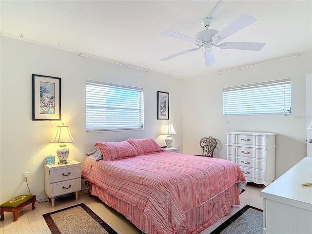 bedroom featuring light wood-type flooring and ceiling fan