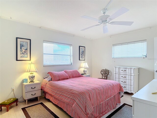 200 Park Blvd N Unit 103, Venice, FL 34285 - bedroom with ceiling fan and light wood-style flooring