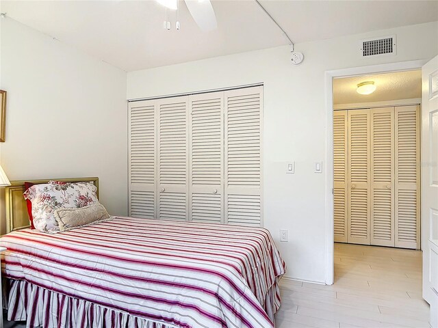 200 Park Blvd N Unit 103, Venice, FL 34285 - bedroom featuring a closet, wood finished floors, and ceiling fan