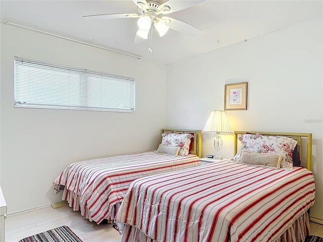 bedroom with light hardwood / wood-style flooring and ceiling fan