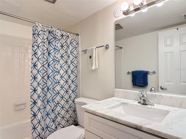 full bathroom featuring vanity, a textured ceiling, toilet, and shower / tub combo