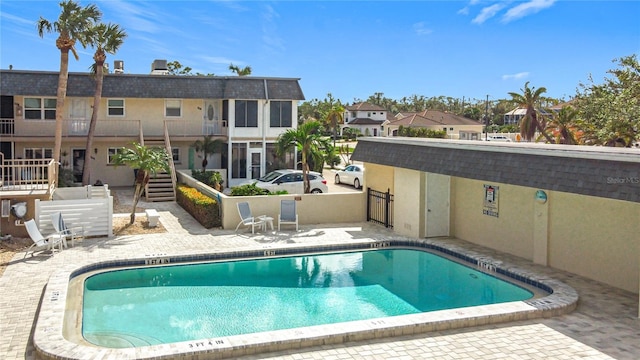 view of swimming pool featuring a patio area