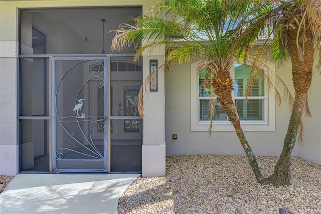 1219 Nantucket Rd, Venice, FL 34293 - doorway to property featuring stucco siding