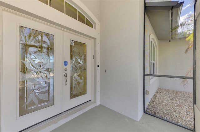 1219 Nantucket Rd, Venice, FL 34293 - property entrance with stucco siding and french doors