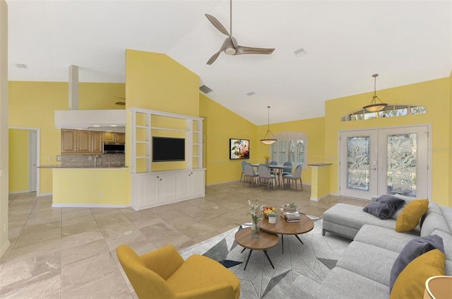 1219 Nantucket Rd, Venice, FL 34293 - living room featuring high vaulted ceiling, ceiling fan, and french doors