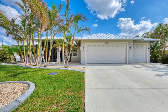 view of front facade with a garage and a front yard