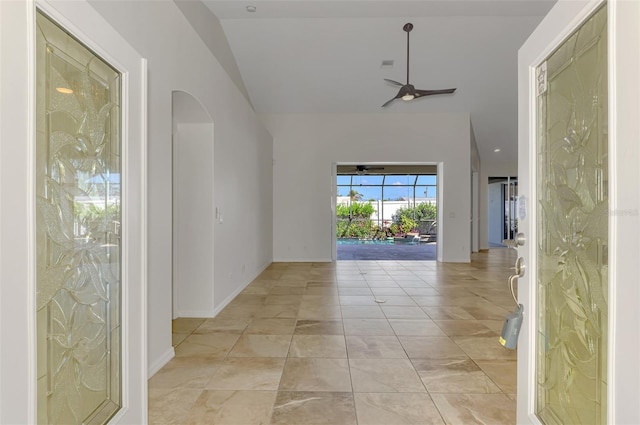 1219 Nantucket Rd, Venice, FL 34293 - unfurnished room featuring arched walkways, ceiling fan, vaulted ceiling, and baseboards
