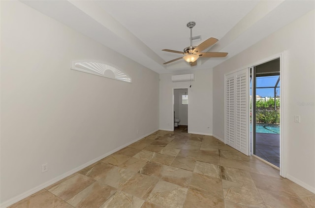 1219 Nantucket Rd, Venice, FL 34293 - spare room featuring light stone finish flooring, a wall unit AC, baseboards, and ceiling fan