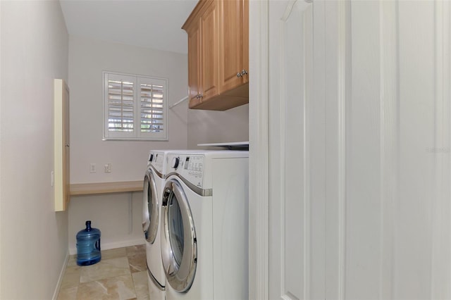 1219 Nantucket Rd, Venice, FL 34293 - washroom featuring cabinet space, washer and dryer, and baseboards