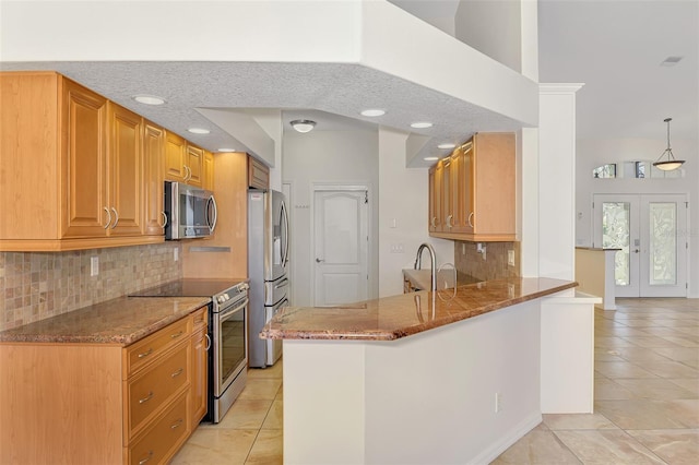 1219 Nantucket Rd, Venice, FL 34293 - kitchen with appliances with stainless steel finishes, light tile patterned floors, stone countertops, tasteful backsplash, and recessed lighting