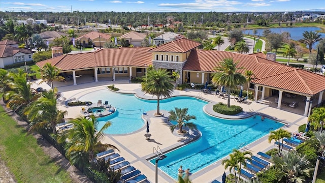 view of pool featuring a water view