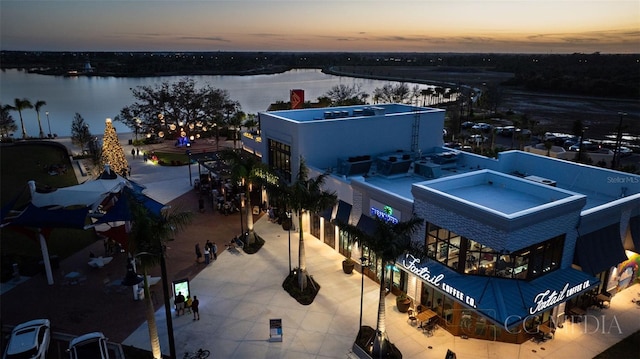 aerial view at dusk with a water view