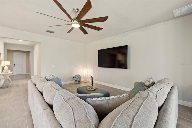 living room with ceiling fan and light tile patterned floors