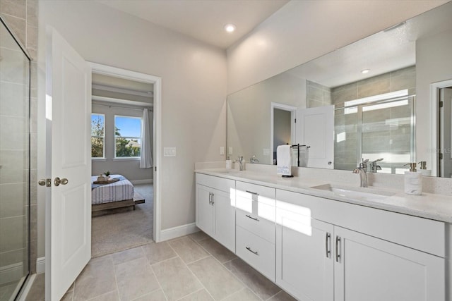 bathroom with tile patterned flooring, vanity, and an enclosed shower