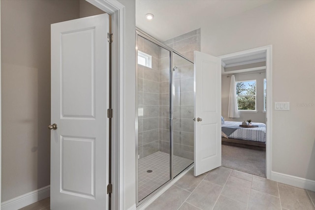 11925 Bohemian Pl, Venice, FL 34293 - ensuite bathroom with a stall shower, baseboards, and tile patterned flooring