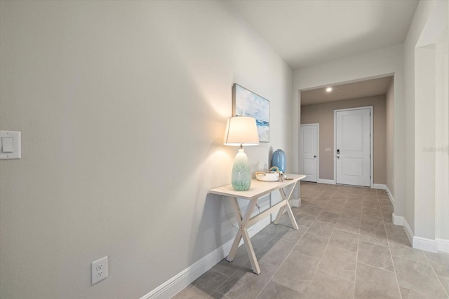 hallway with light tile patterned flooring