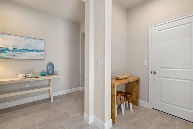 11925 Bohemian Pl, Venice, FL 34293 - hallway featuring baseboards