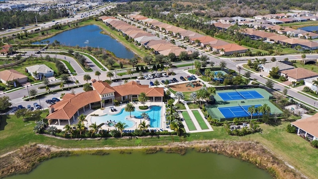 birds eye view of property with a water view