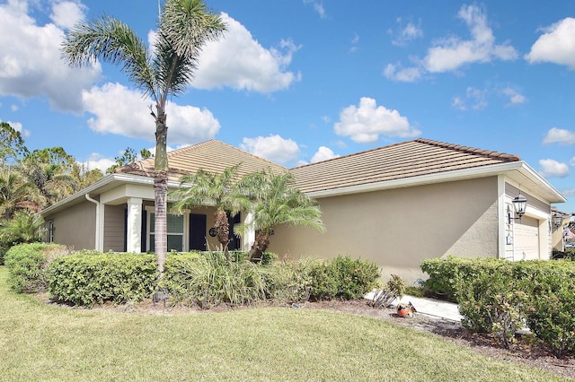 exterior space with a lawn and a garage