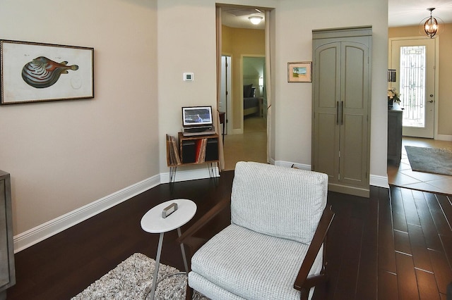 sitting room with dark hardwood / wood-style floors