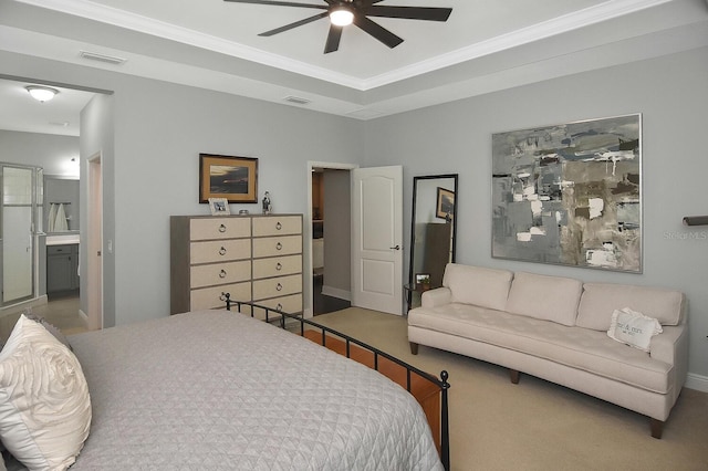 bedroom with connected bathroom, carpet flooring, and ceiling fan