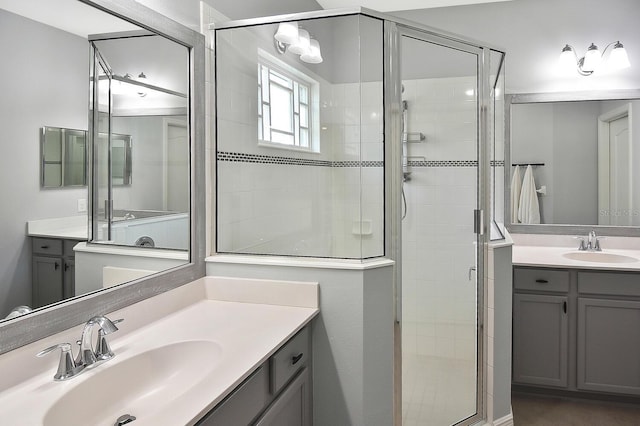 bathroom featuring vanity and a shower with door