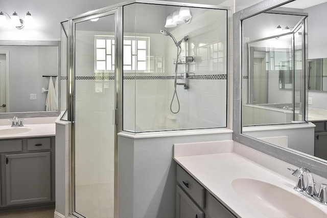 bathroom featuring vanity and a shower with shower door