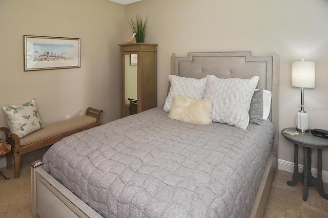 bedroom featuring light colored carpet