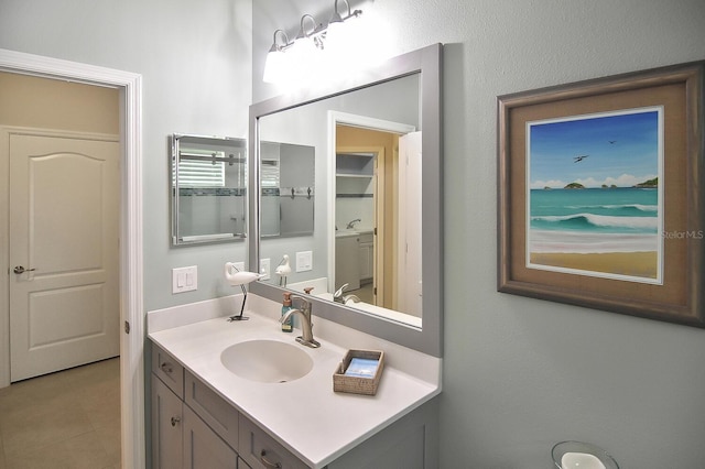 bathroom with vanity and tile patterned flooring