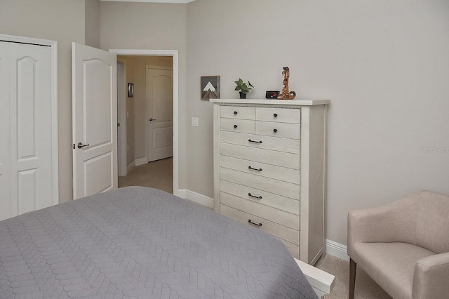 bedroom featuring light colored carpet