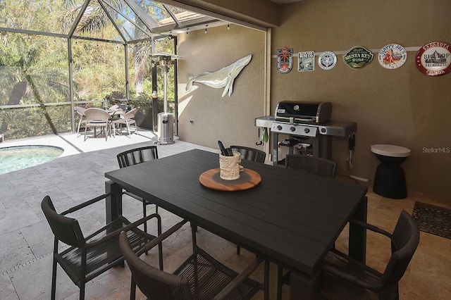 view of patio / terrace featuring a lanai and area for grilling