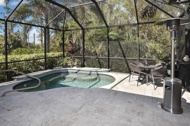 view of pool with a lanai and a patio