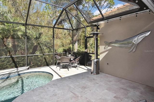 view of pool featuring a patio and a lanai