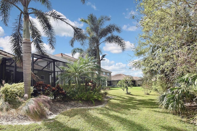 view of yard featuring a lanai