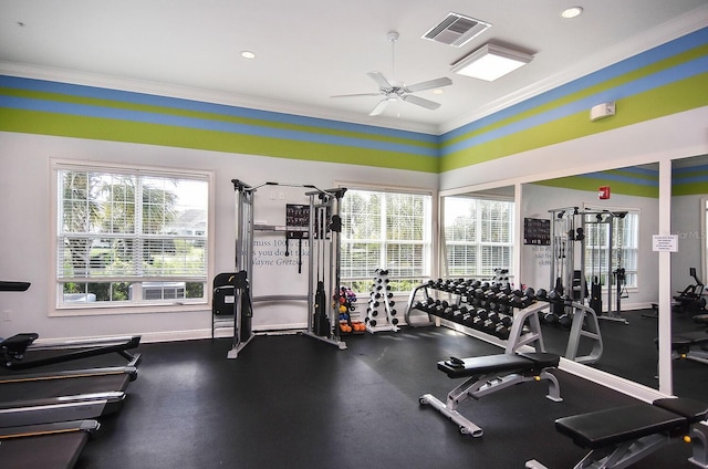 gym with ceiling fan and crown molding